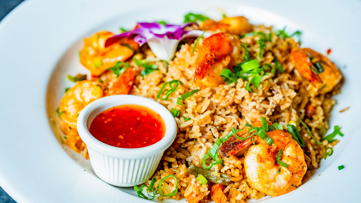 Shrimp fried rice with dipping sauce, shot from above for social media